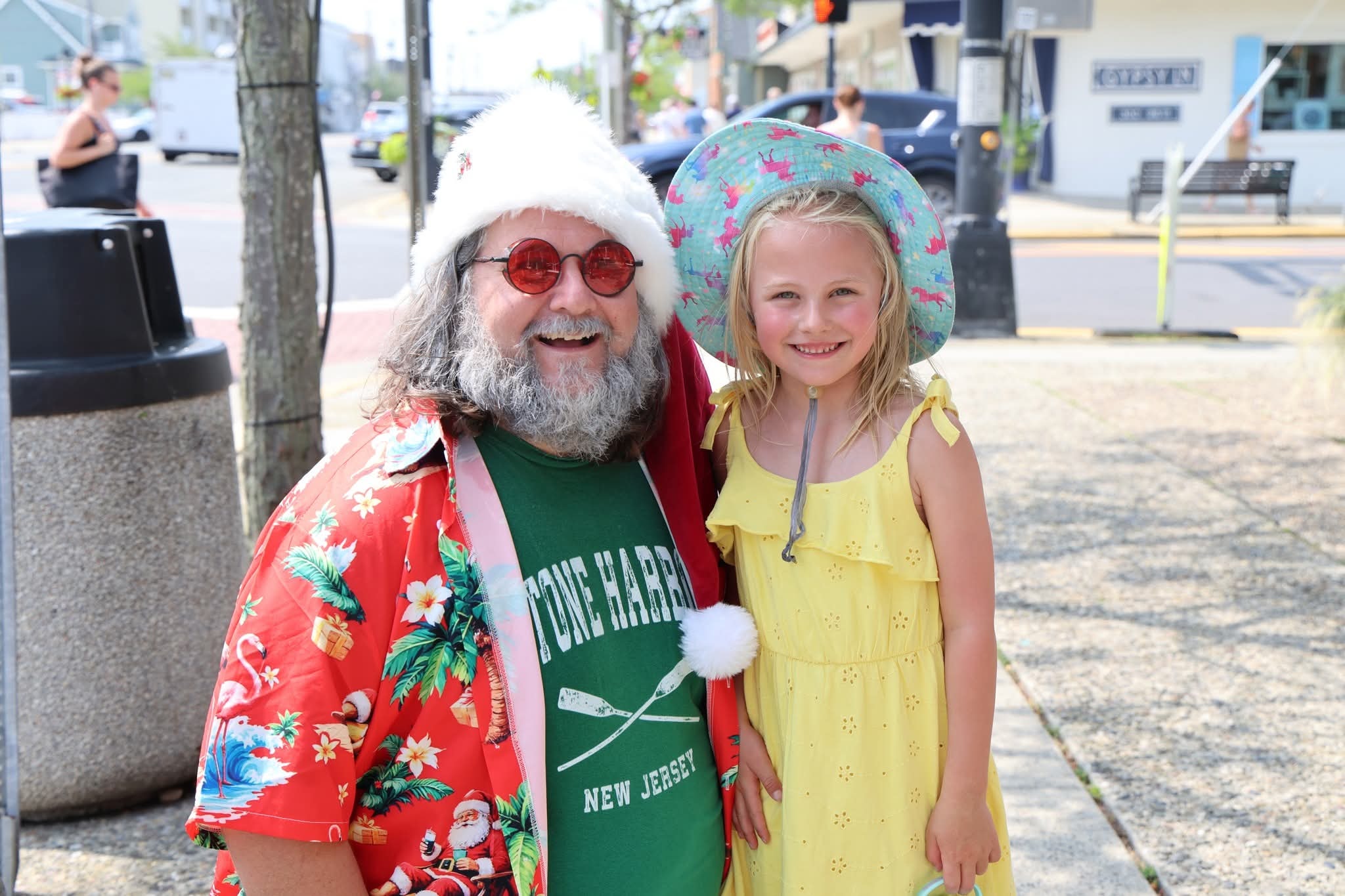 Cape May County Santa kneeling with a child