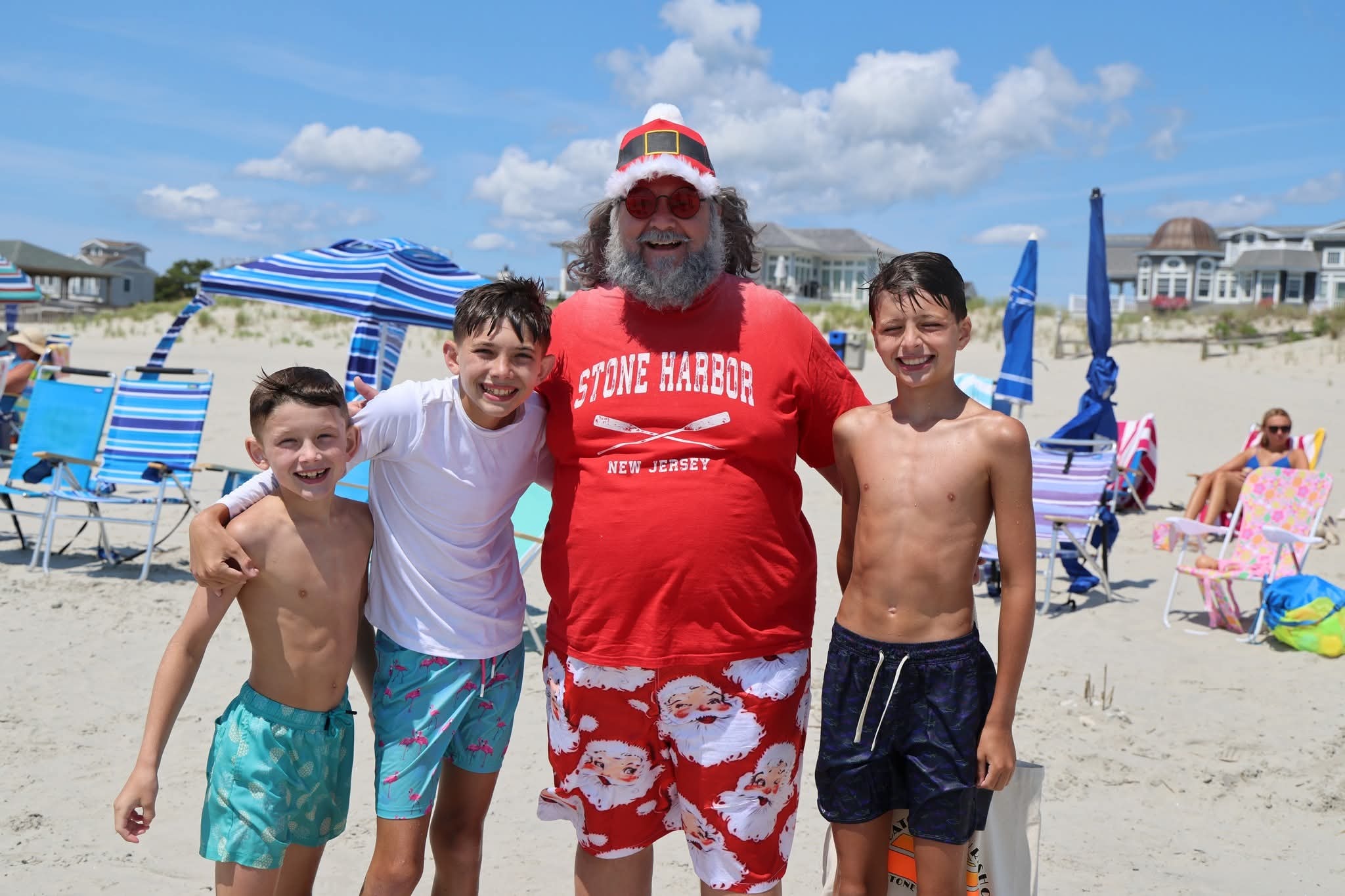 Cape May County Santa with three boys on the beach in Stone Harbor