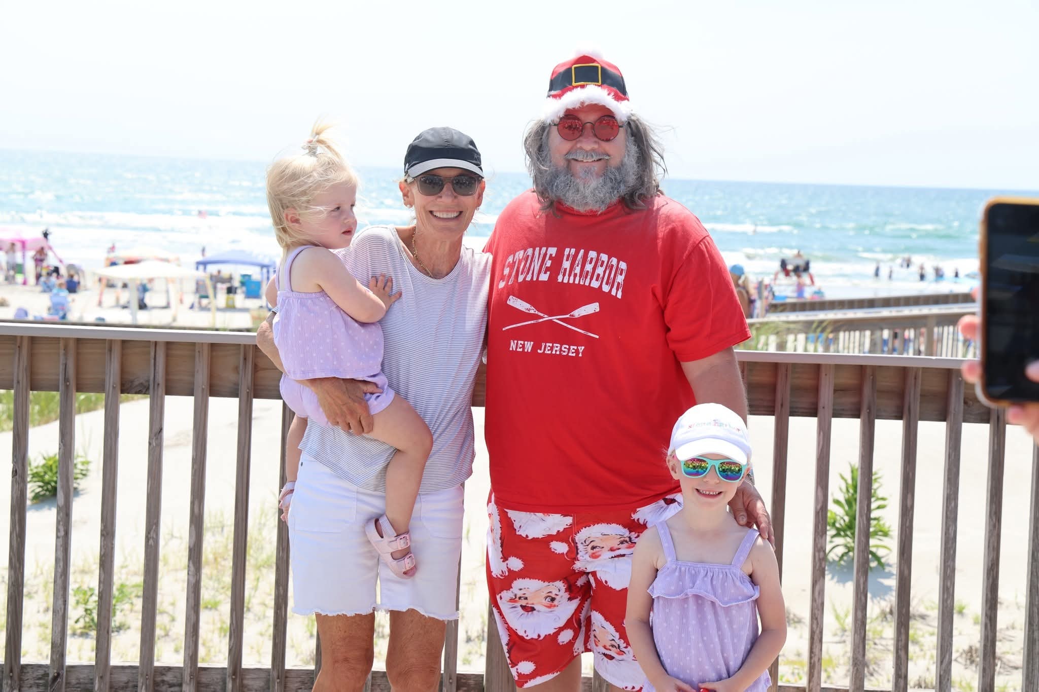 Cape May County Santa with a grandmother and two granddaughters on the boardwalk