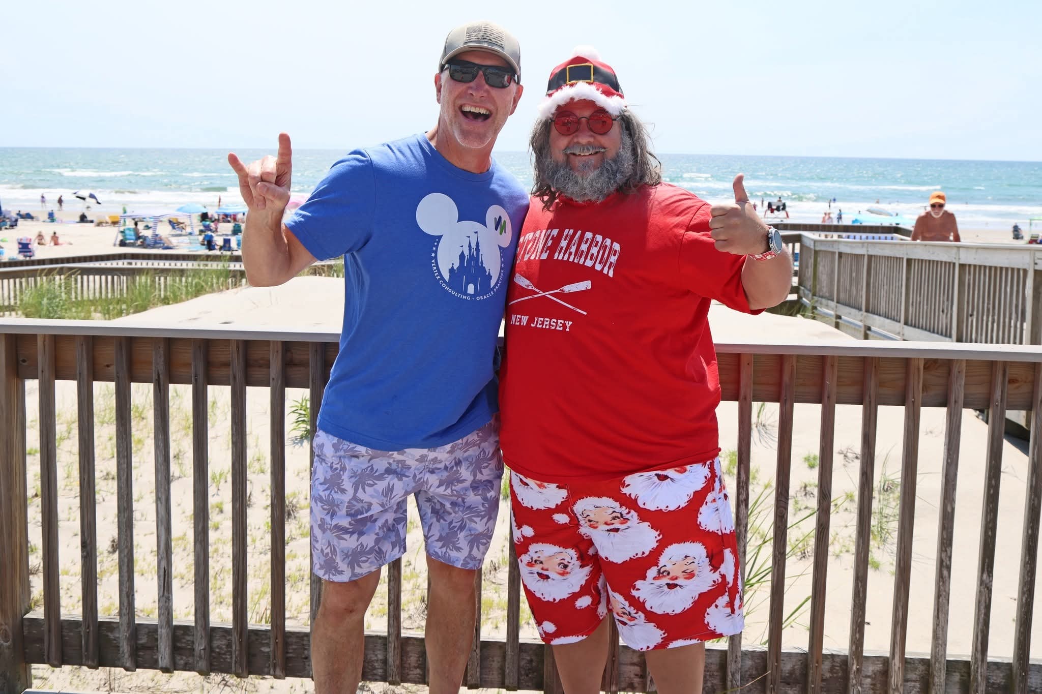 Cape May County Santa and a man on the boardwalk both giving thumbs up