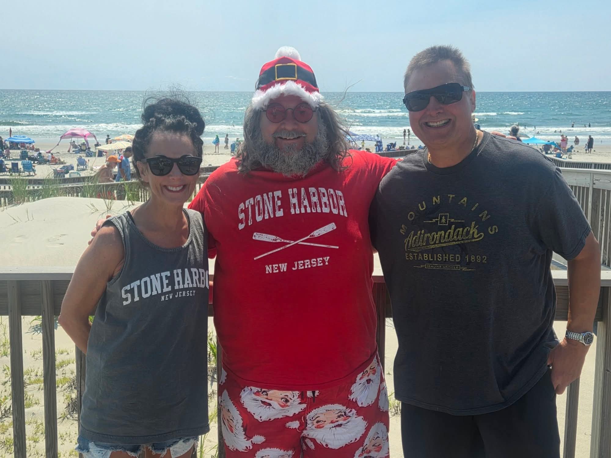 Cape May County Santa with a couple on the Stone Harbor boardwalk deck
