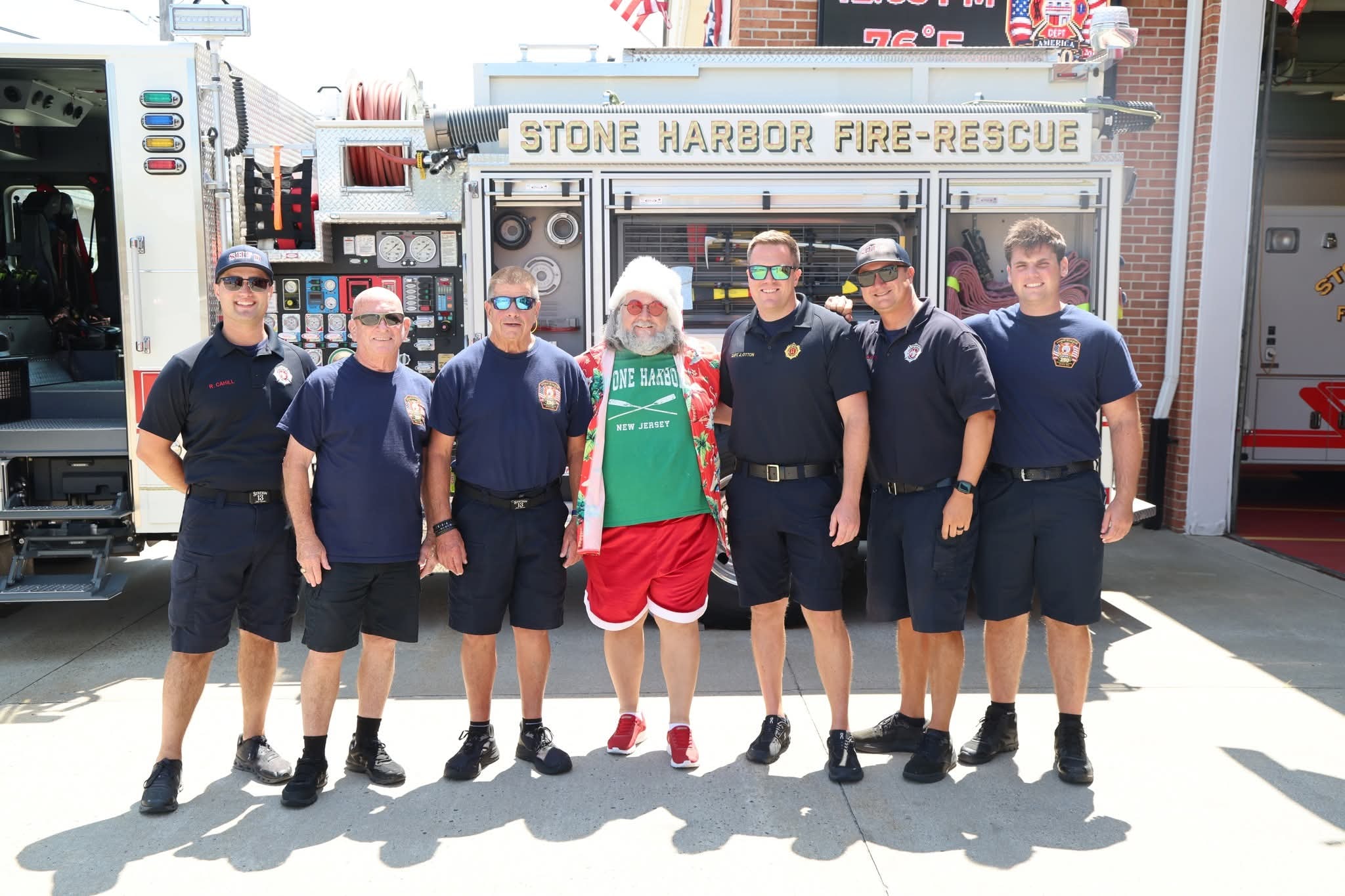 Cape May County Santa with Stone Harbor Fire-Rescue firefighters in front of the fire truck