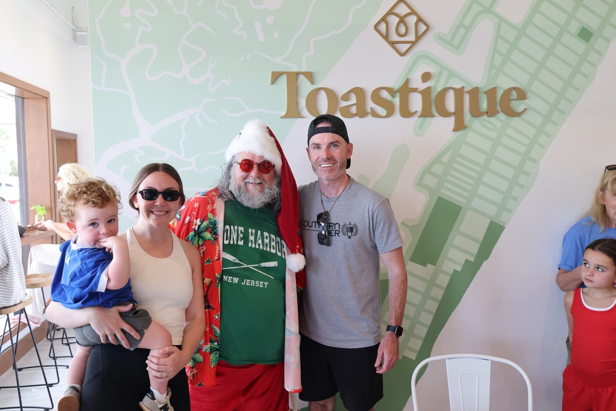 Cape May County Santa with a family at Toastique in Stone Harbor