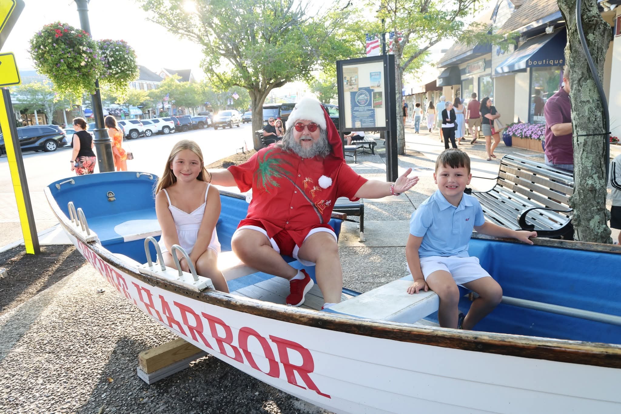 Cape May County Santa with a girl and boy in the Stone Harbor boat at golden hour