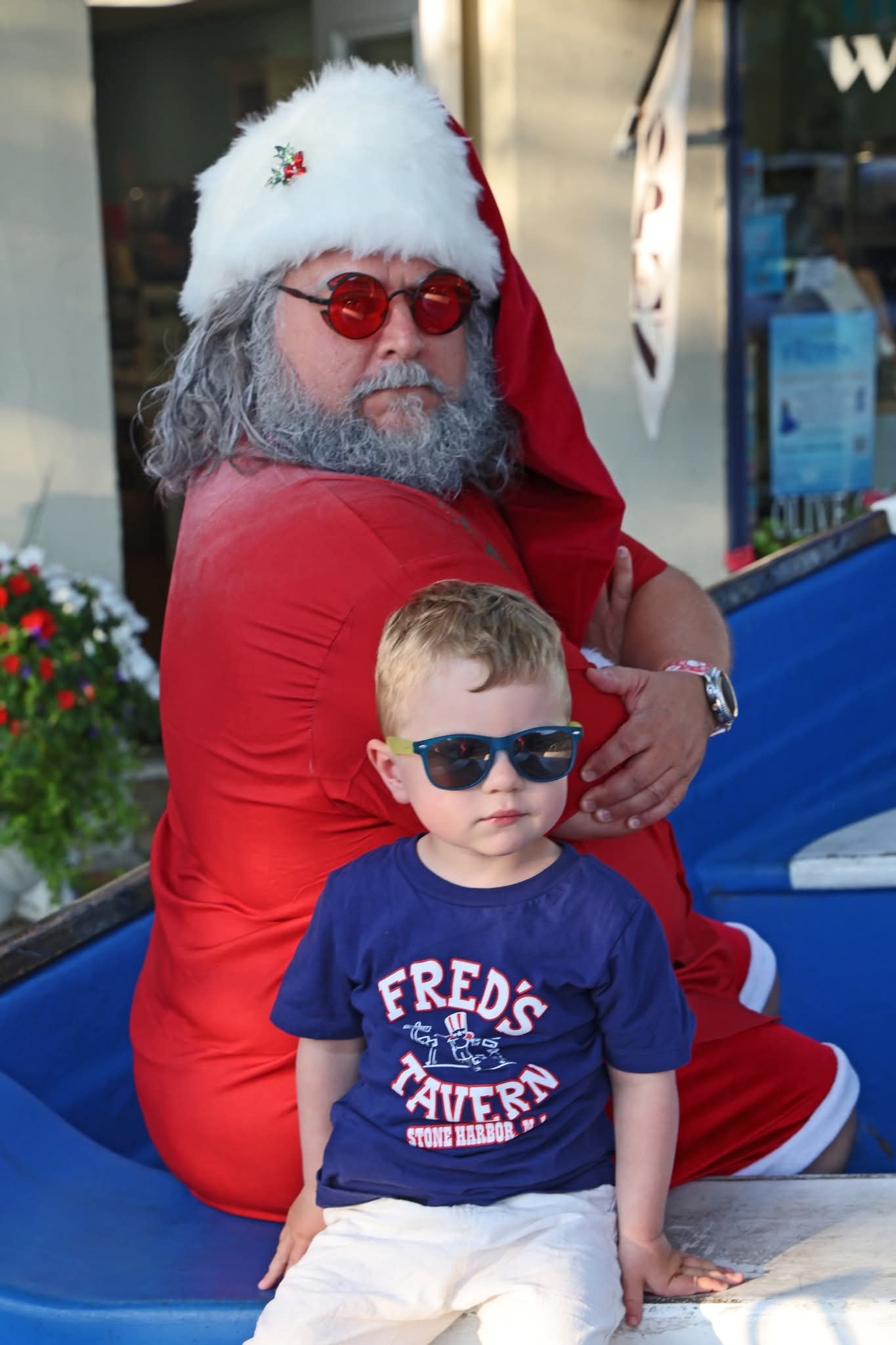 Cape May County Santa with a toddler boy in matching sunglasses in the Stone Harbor boat