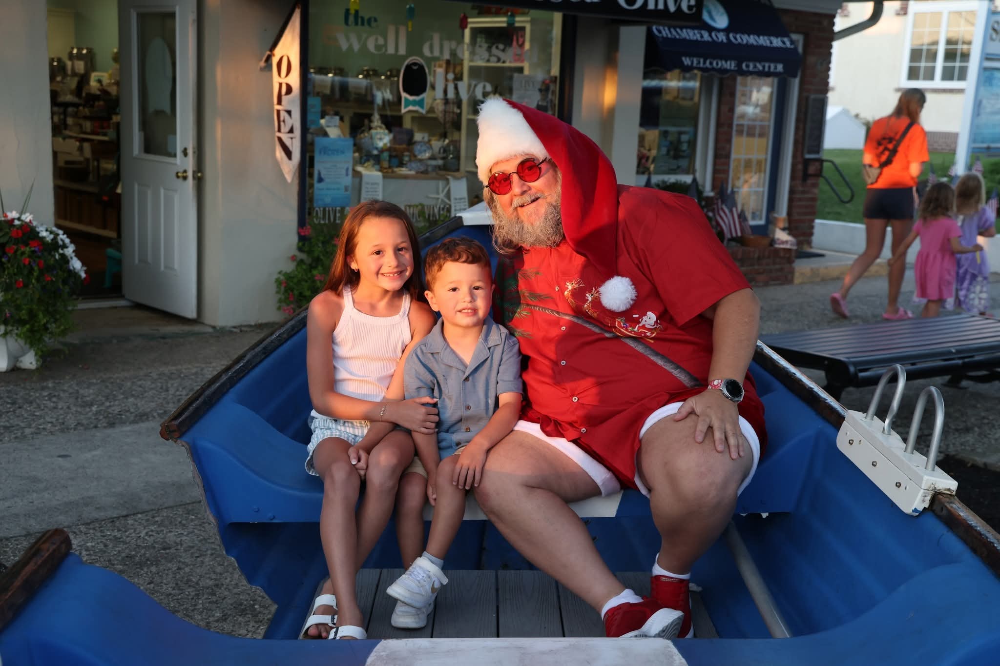 Cape May County Santa with a girl and toddler boy in the Stone Harbor boat